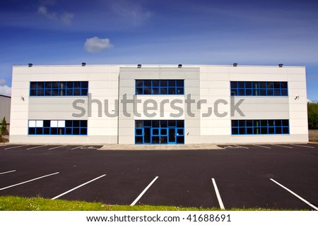 photo of white corporate office block for rent