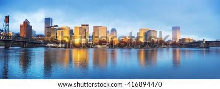 tranquil water,cityscape and skyline of portland in blue sky