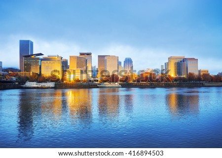 tranquil water,cityscape and skyline of portland in blue sky