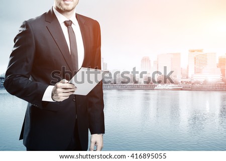 businessman with tablet on cityscape and skyline of portland
