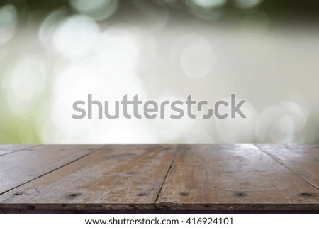 Wood table top on blur nature background