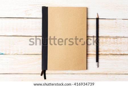 Diary notebook with pencil on white wooden background, Business template mock up