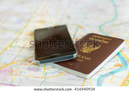 Close up Thailand Passport and smartphone on Chiang Mai Thailand Map, soft focus