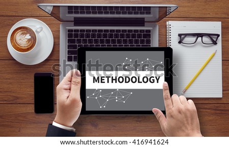 METHODOLOGY CONTEPT , on the tablet pc screen held by businessman hands - online, top view