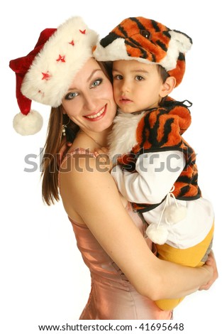 Mother with baby in fancy dress in the form of tiger on white background