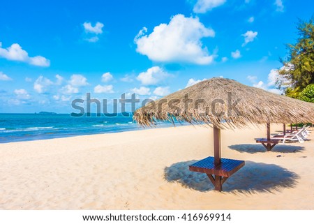 Umbrella and chair on beautiful tropical beach and sea - Boost up color Processing - Holiday vacation concept background