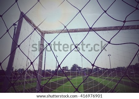 Soccer sport field with poles and net for recreation background