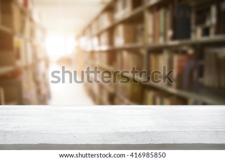 Empty wooden desk space platform with library background for product display.