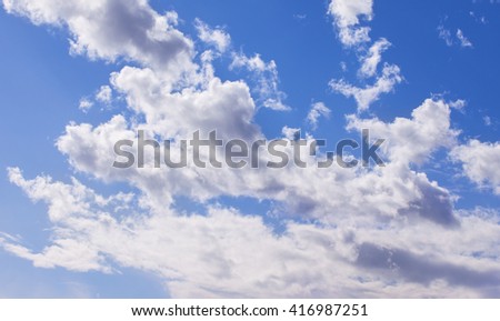 Big white cloud on the blue sky. Beautiful background.