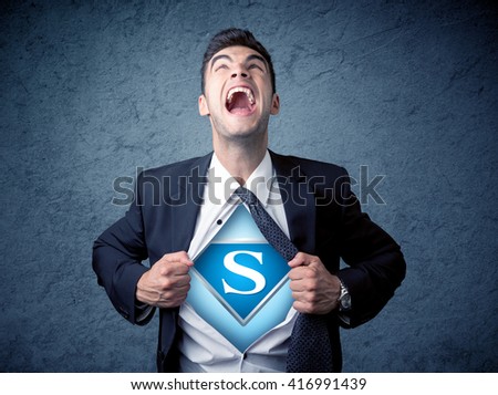 Businessman ripping off his shirt with superhero sign on his chest concept on background