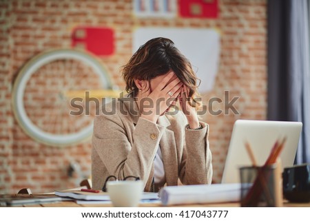 Headache In Office Royalty-Free Stock Photo #417043777