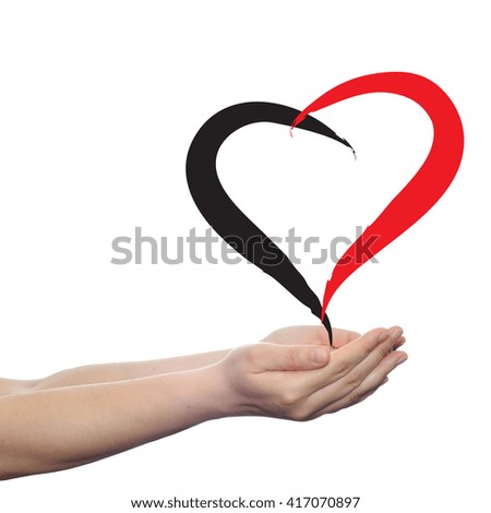 Concept or conceptual painted red heart shape love symbol made by happy child at school, held in human man or woman hand isolated on background metaphor to valentine, romantic, education, art feeling