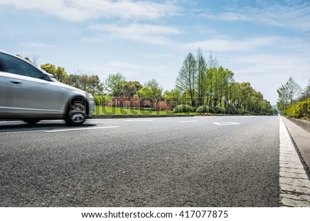Car ride on road in sunny weather, motion blur