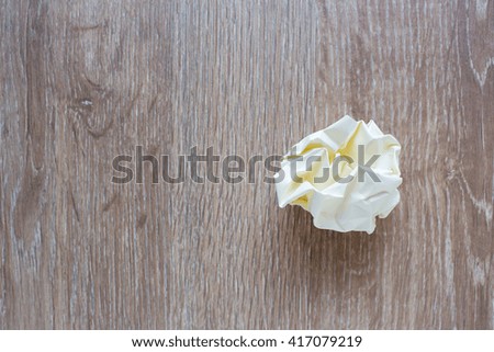 Waste Paper on Wooden Background