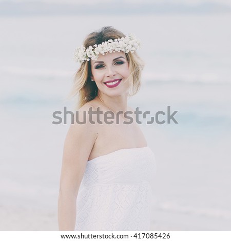 Beautiful blond fiancee in white wedding dress, selective focus and square image