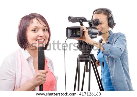 a young woman journalist with a microphone and camerawoman
