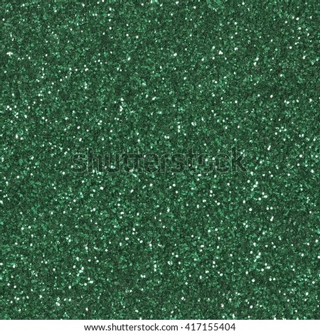 Abstract green glitter background. Low contrast photo. Seamless square texture. Tile ready.