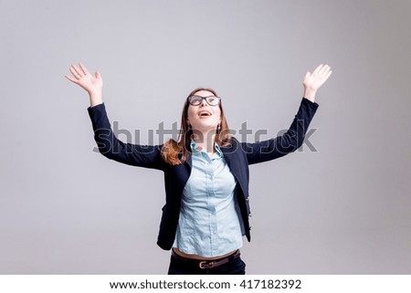 Business woman in the office on the gray background