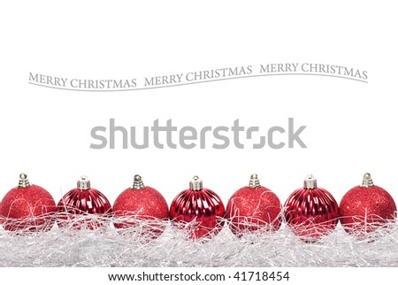 Red christmas baubles against white background with space for text