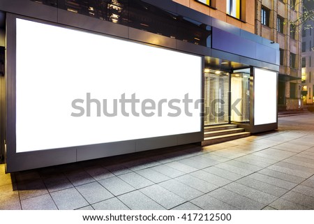 Mock up of blank white modern showcase in a city at night