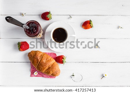 Breakfast of coffee, jam, croissant and strawberry. Top view, flat lay Royalty-Free Stock Photo #417257413