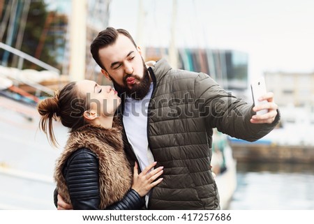 Picture of young couple taking selfie