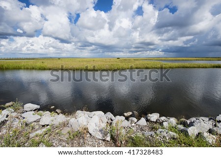 Storm Clouds over the Louisiana Marsh at Grand Isle Royalty-Free Stock Photo #417328483