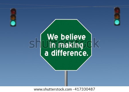 sign at traffic light on blue sky background We believe in making a difference  and blue sky