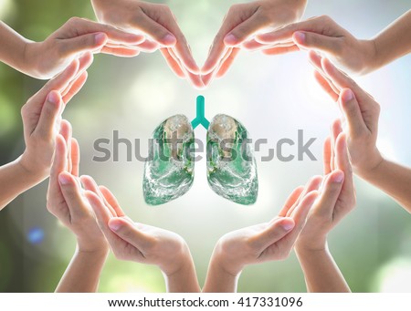 World Tuberculosis Day and World no tobacco day campaign, healthy lung in heart-shaped hand protection health care design logo concept. Element of this image furnished by NASA Royalty-Free Stock Photo #417331096