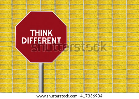 red stop sign with yellow brick background and text think different