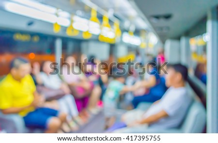 Abstract blur image of inside the bus with  passenger for background usage .