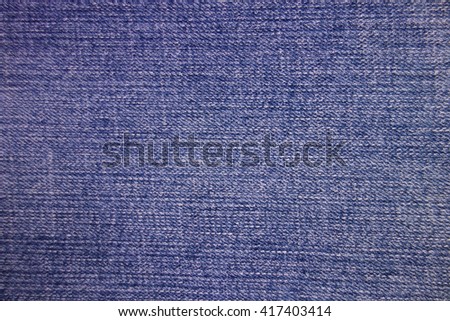 Denim textile texture, navy jeans fabric plain surface background.