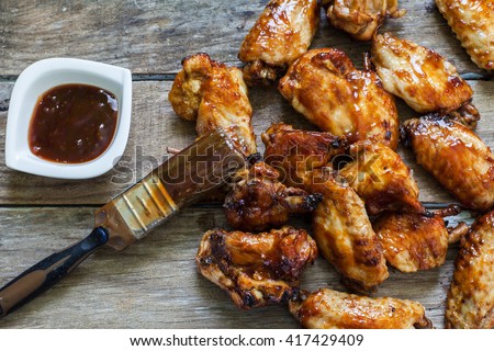 BBQ chicken wings with sauce for dip Royalty-Free Stock Photo #417429409