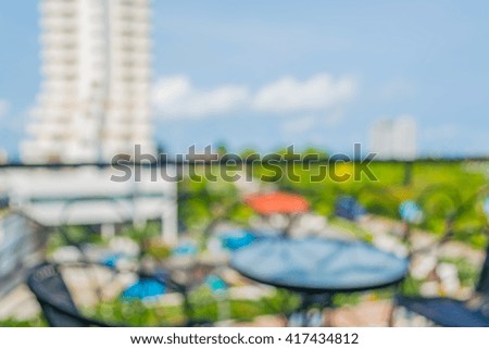 image of blur chair and table in hotel resort with bokeh for background usage .