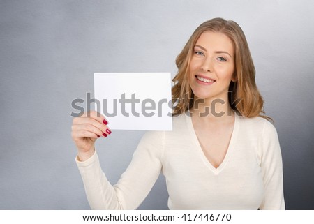 Businesswoman holding a blank business card