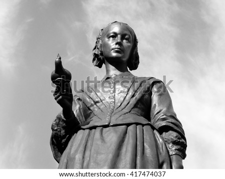 Black and white image of the Victorian memorial statue of Florence Nightingale 1820-1910 in London, England, UK Royalty-Free Stock Photo #417474037