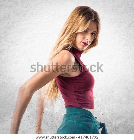 Young urban woman dancing