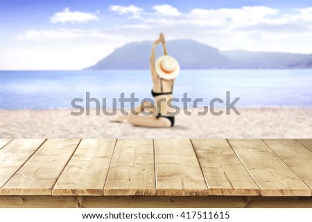 summer landscape of beach and table place and woman 
