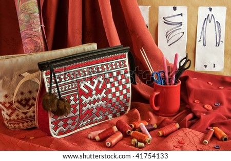 fashion sketches, handbags, red fabric, buttons and thread