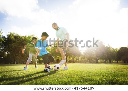 Soccer Fun Sports Family Playing Concept Royalty-Free Stock Photo #417544189