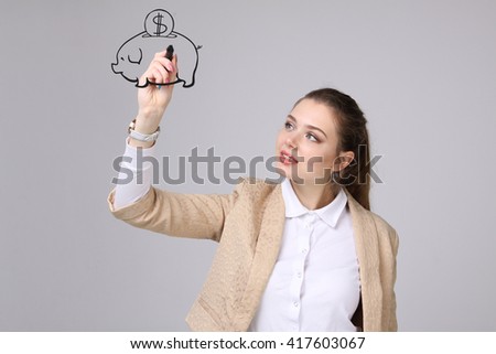 young woman drawing a piggy Bank