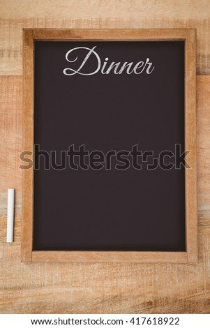 Dinner message on a white background against composite image of a slate
