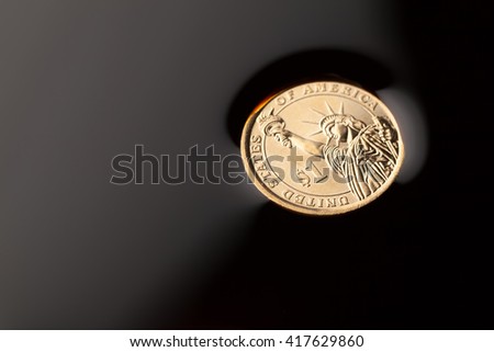 dollar coins in the crude oil - barrel price concept