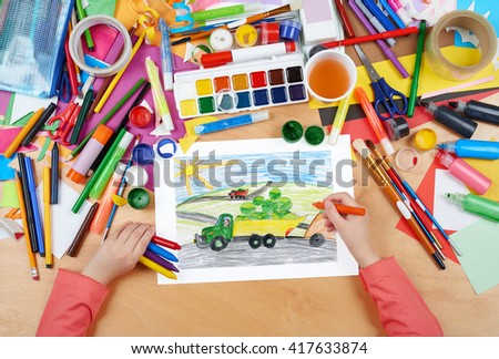 harvesting, truck with vegetables goes off field, dog driver, agriculture concept, child drawing, top view hands with pencil painting picture on paper, artwork workplace