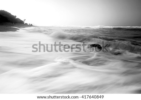 Sunset on the beach of Kukup, Yogyakarta with various pattern of motion blur waves. Nature composition,grain and noise effect,soft focus and vibrant colours.