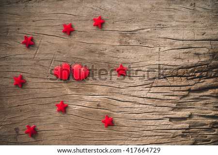 heart and star on a wooden background.