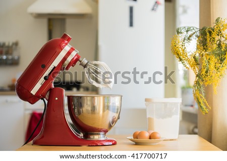 red stand mixer mixing cream Royalty-Free Stock Photo #417700717