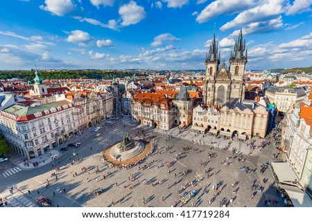 Old Town of Prague, Czech Republic. View on Tyn Church and Jan Hus Memorial on the square as seen from Old Town City Hall. Blue sunny sky Royalty-Free Stock Photo #417719284