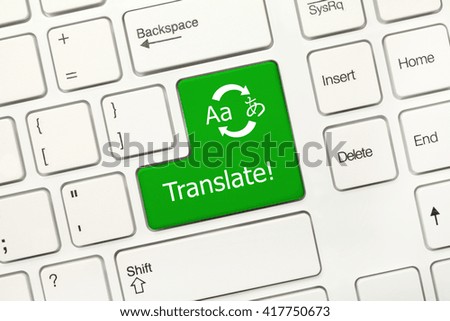 Close-up view on white conceptual keyboard - Translate (green key with translation symbol)