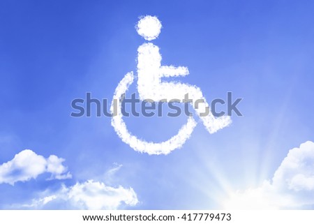 Wheelchair Symbol written a cloud with a blue sky